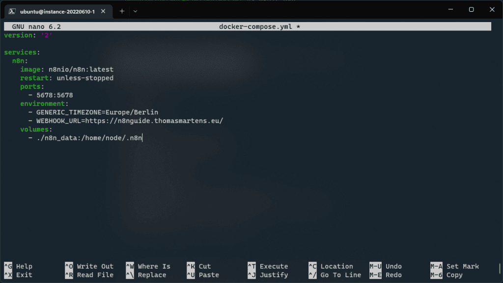 The nano editor showing the docker-compose.yml file